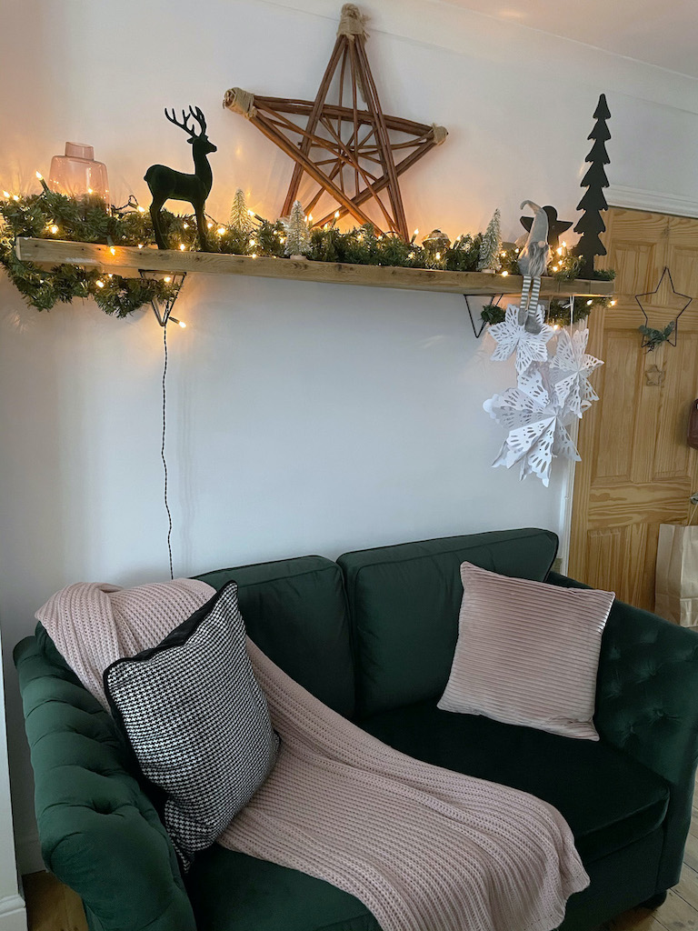 Dark green quilting sofas on the sides Gala in a Christmas interior design