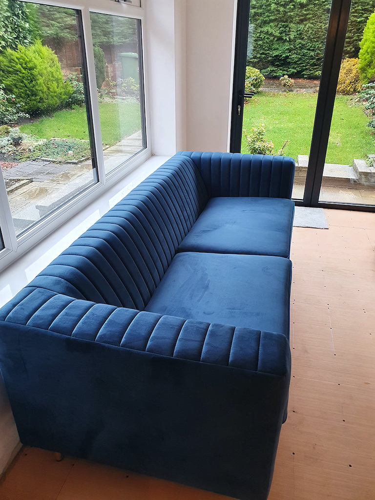 Slender blue three-seater sofa from Dana