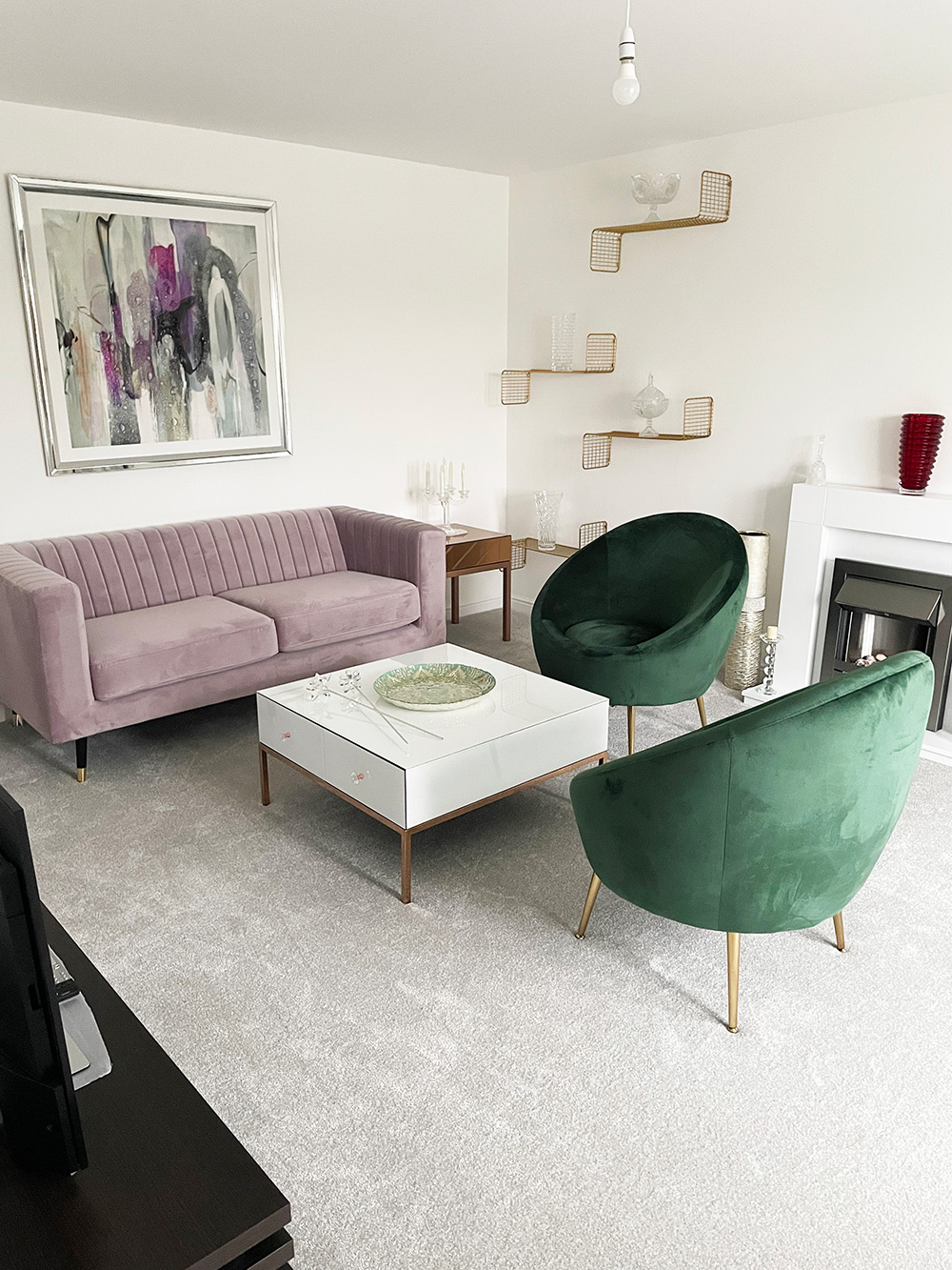 Slender sofa in powder pink in modern living room