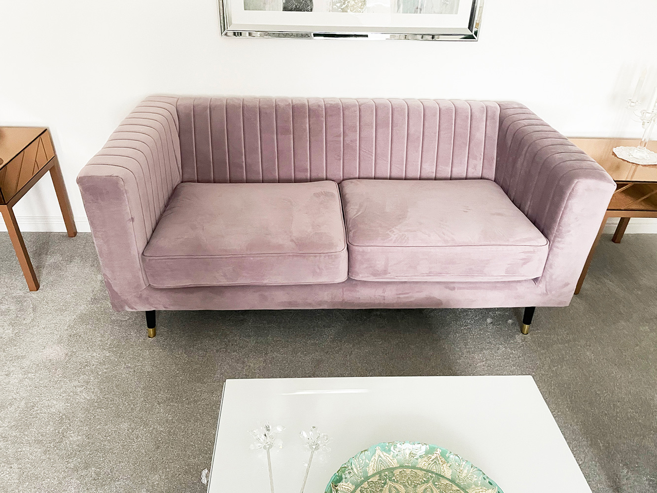 Slender sofa in powder pink in modern living room